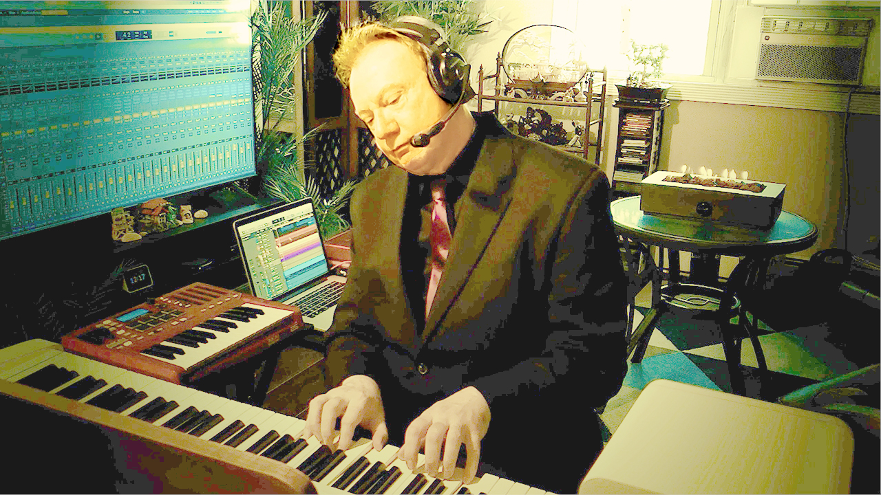 David West playing keyboard in and singing